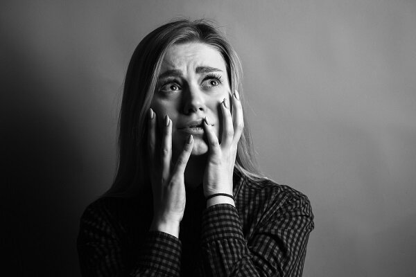 Portrait of scared young woman. Black and white.jpg